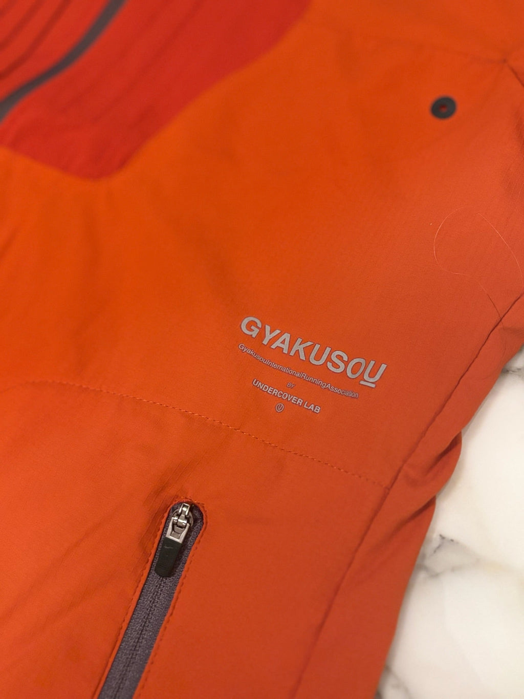 Gyakusou Orange Running Top